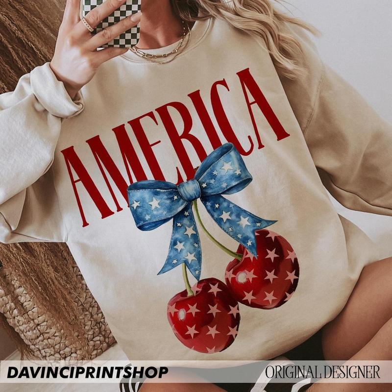 America Cherries Sweatshirt, Cherry Bow Tee, Trendy July 4th Shirt, 4th of july Woman Shirt, Usa Flag Hoodie | TeeBloomCo.com