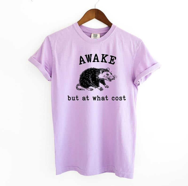 Awake at what cost Graphic Tee, Possum Meme Comfort Colors Shirt Hoodie, Sweatshirt | TeeBloomCo.com