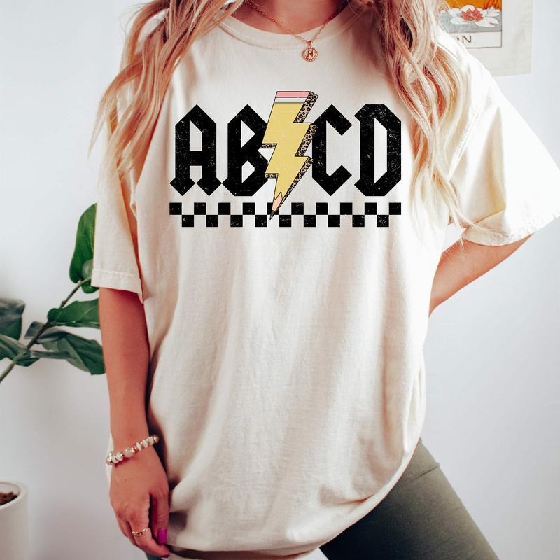 Comfort Colors Checkered ABCD Teacher Shirt, Kindergarten Teacher Shirt, Back To School T-Shirt, Elementary School Shirt...