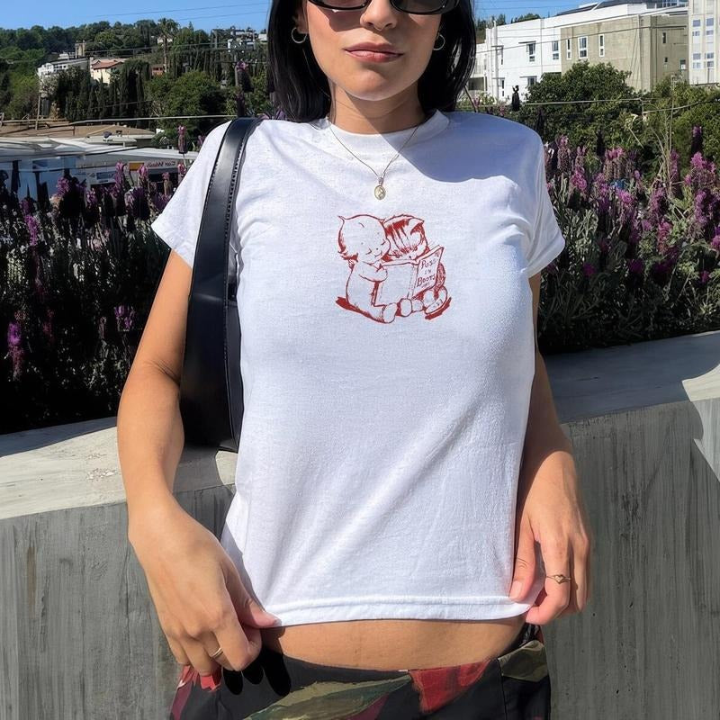 Cute Kewpie Baby Reading Puss in Boots Book to Kitten, Coquette Red Baby Tee, Hand-Drawn Minimalist Tee, Vintage Shirt,...