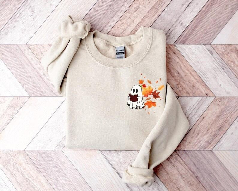 Fall Ghost Book Sweatshirt, Ghost Reading Book Under Fall Leaves, Spooky Season Pullover, Ghost Shirt, Ghost read more...