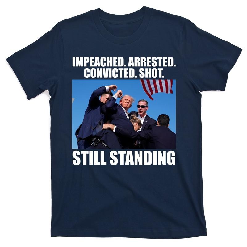 Impeached Arrested Convicted Shot Still Standing Donald Trump T-Shirt Hoodie, Sweatshirt | TeeBloomCo.com