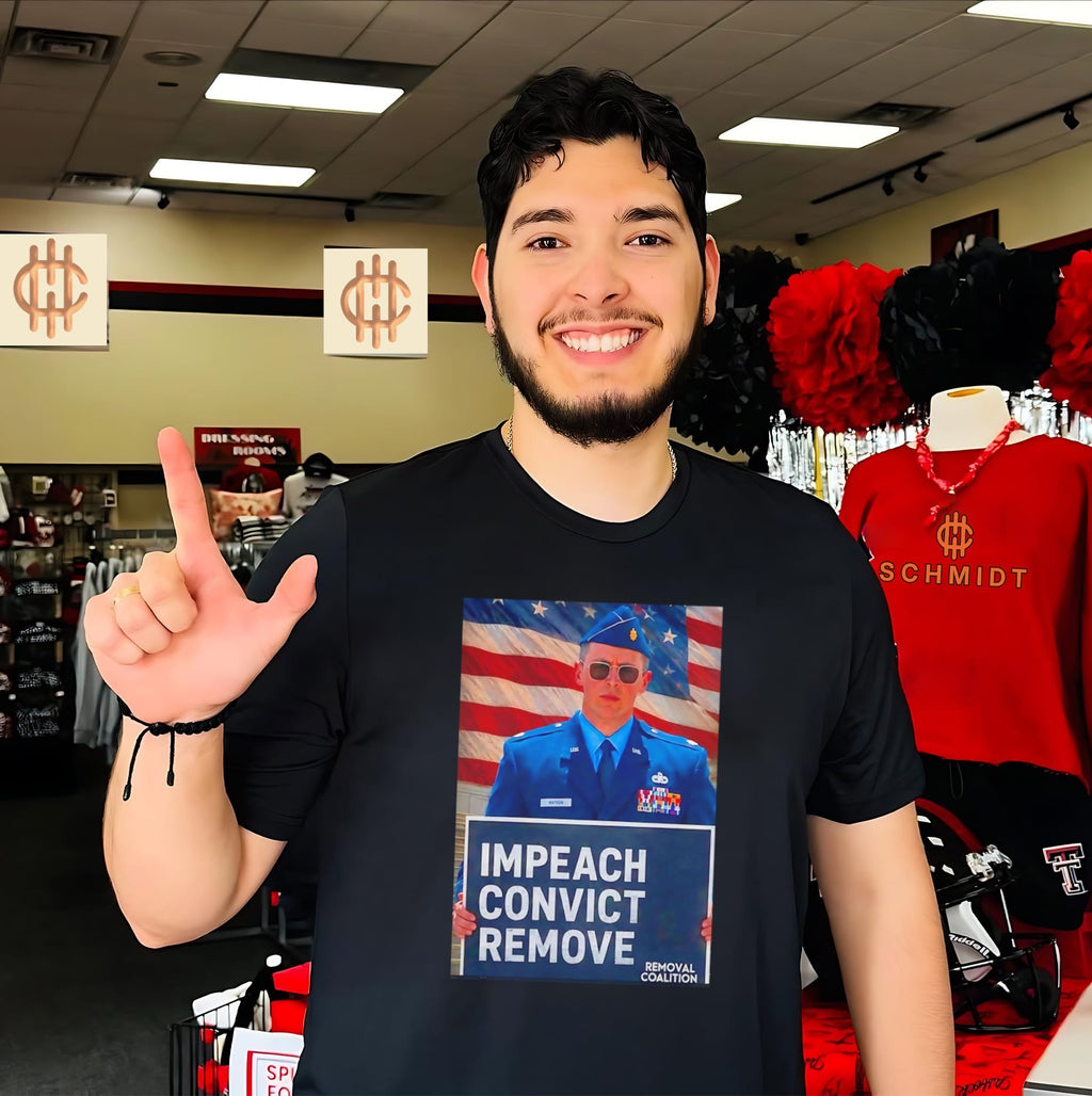 Major Jason Watson holding sign impeach convict remove shirt