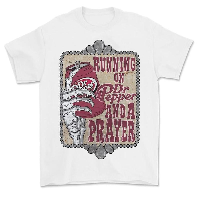 Running On Dr Pepper And A Prayer T-Shirt, Running on Prayer And Dr. Pepper T-Shirt Hoodie, Sweatshirt | TeeBloomCo.com