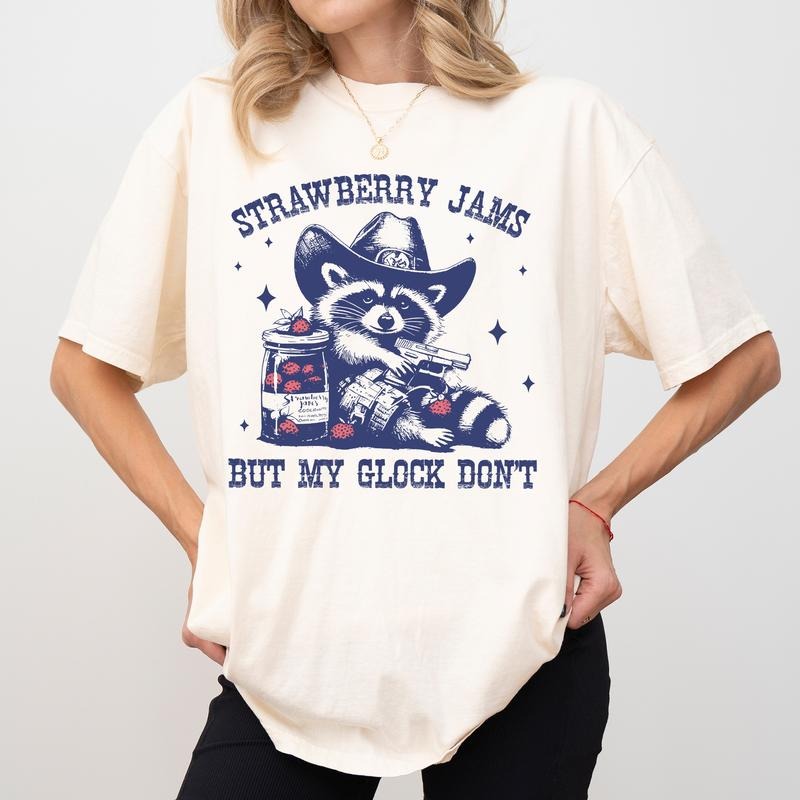 Strawberry Jams But My Glock Don't Comfort Colors Shirt, Western Cowboy Raccoon T-shirt, Funny Meme Graphic Tee, Raccoon...