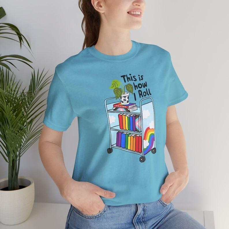 This Is How I Roll Pride Shirt, LGBTQIA Library T-Shirt, Queer Bookish Apparel, Librarian Gift Hoodie, T-shirt and...