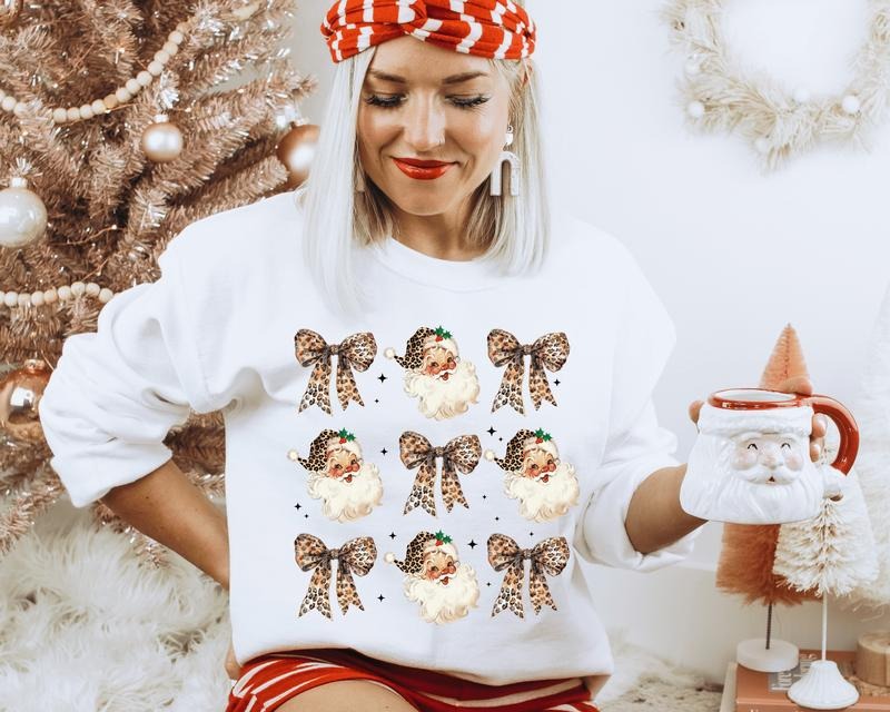 Vintage Leopard Santa with Coquette Bows Crewneck. Relaxed Christmas Unisex Pullover Crewneck Sweatshirt. T-Shirts, Hoodie
