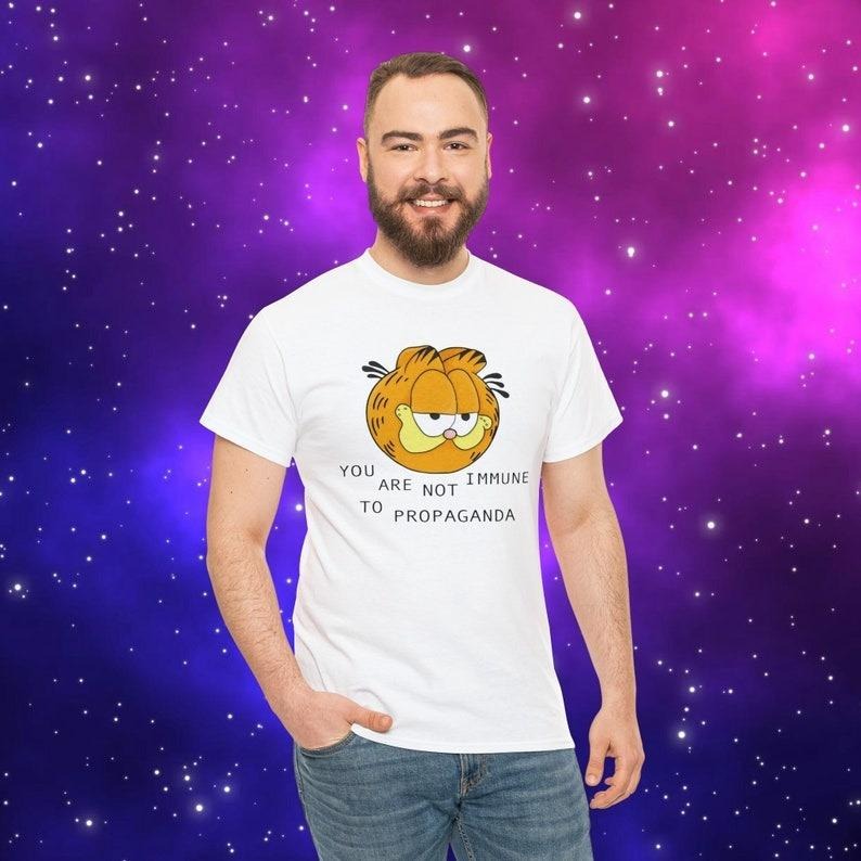 You Are Not Immune To Propaganda Shirt | Garfield You Are Not immune to Propaganda shirt Hoodie, Sweatshirt | TeeBloomCo.com