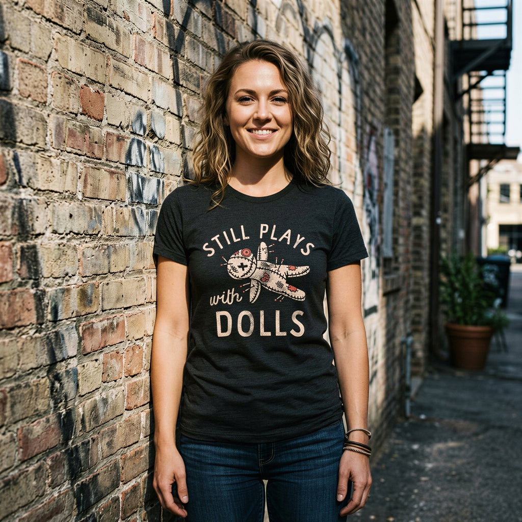 Still Plays With Dolls Women's T Shirt