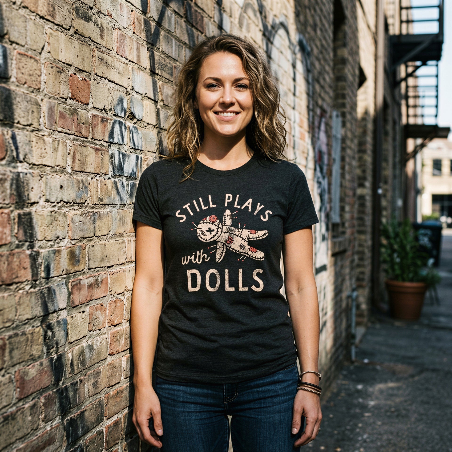 Still Plays With Dolls Women's T Shirt