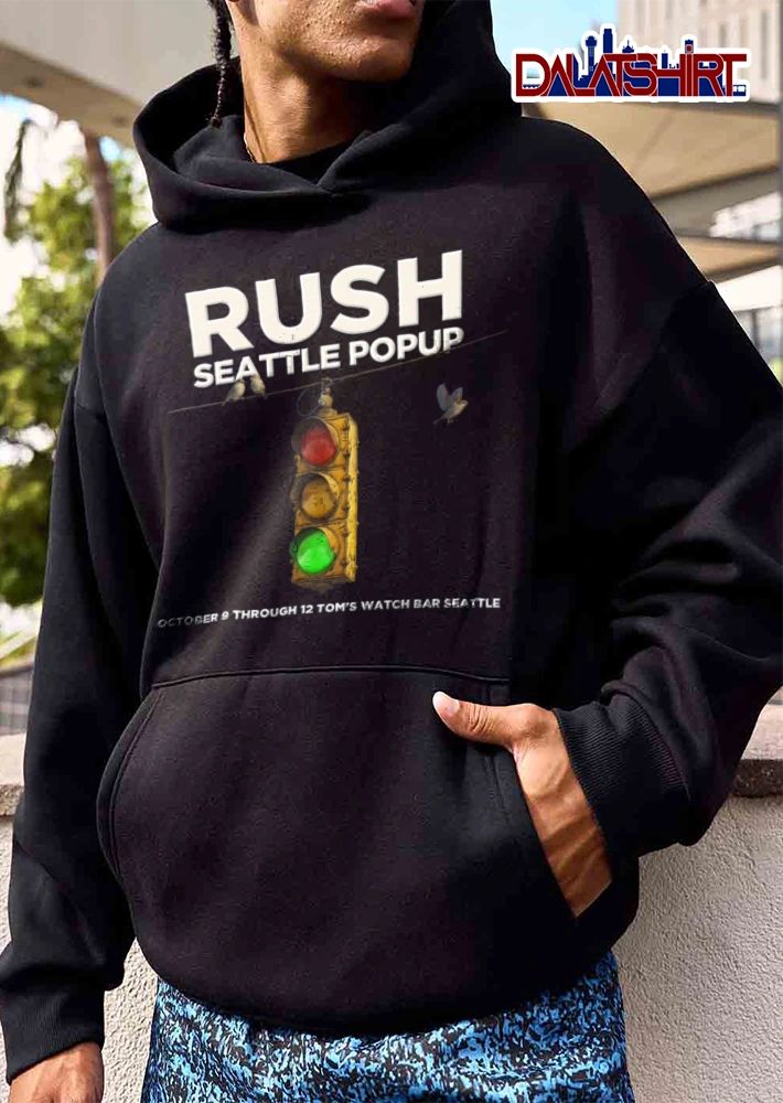 Rush Koch Bar 9 12 traffic light birds blue sky shirt