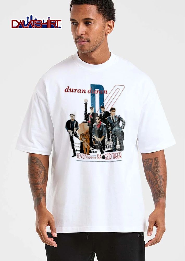 Duran Seven AND THE Ragged Tiger band members posing with shirt