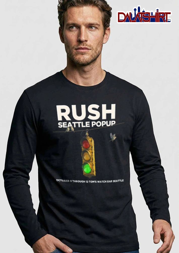 Rush Koch Bar 9 12 traffic light birds blue sky shirt
