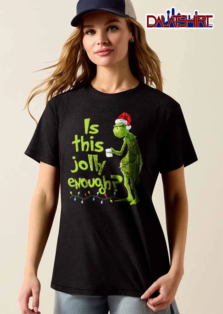 Is This Jolly Enough green furry creature Santa hat holding mug wrapped in Christmas lights shirt