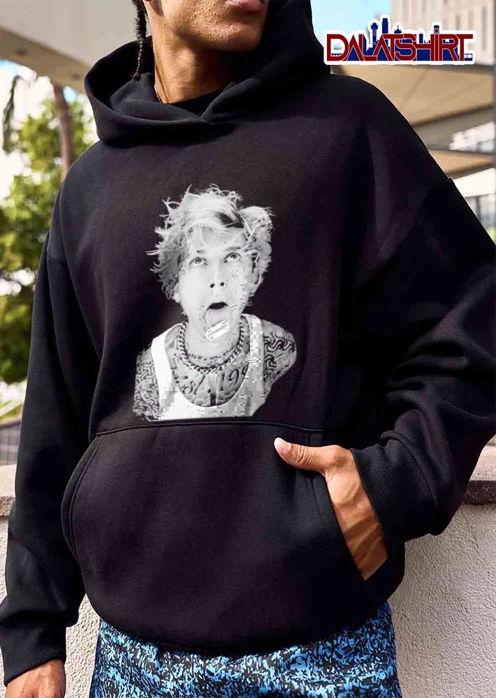 Machine Gun Kelly 1990 man blonde hair razor tongue shirt
