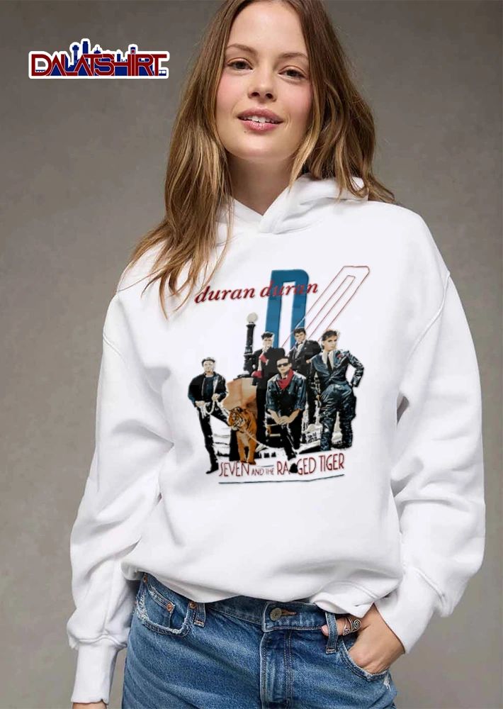 Duran Seven AND THE Ragged Tiger band members posing with shirt